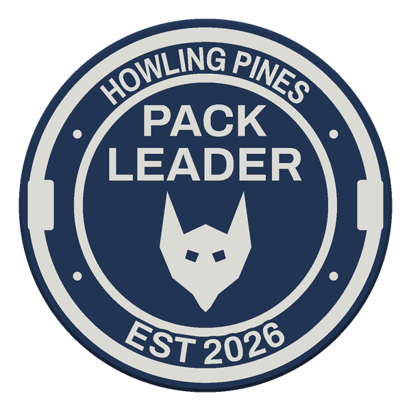 A navy and white challenge coin reading PACK LEADER